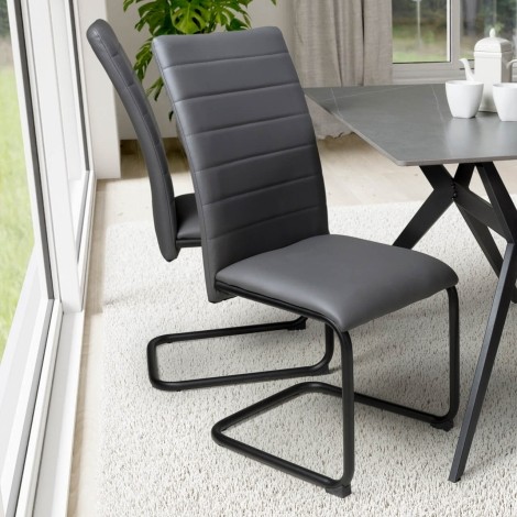 Carlisle - Set of 4 Grey Faux Leather Dining Chairs - Black Metal Legs